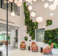 Reception area with high ceilings and amber chairs