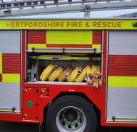 Myles in a fire truck at an owner's talk event