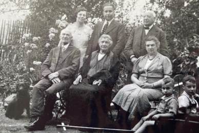 A picture of Mr Fieldsend's parents (back left and centre) grandparents (back right & front left) Mr Fieldsend (front right ) his brother (next to him on the right)